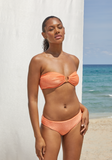 Model standing on the beach wearing the Ella Top and Lure Bottom in Horizon Terry Sheen
