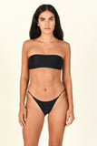Model standing while wearing the All Around Bandeau in black