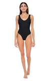 Model standing against white background wearing the Contour One Piece in Black