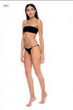 Model posing against white background while showing the side of the All Around Bandeau and Bare Minimum Bottom in Black