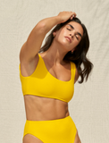 Model wearing the Rounded Edges Top and Incline Bottom in Canary